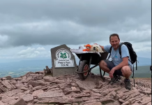 A Pawfect Farewell: Touching Photos Show A Man Taking His Dying Pet Labradoodle, 10, Up His Favourite Mountain On One Last Walk With The Aid Of A Wheelbarrow
